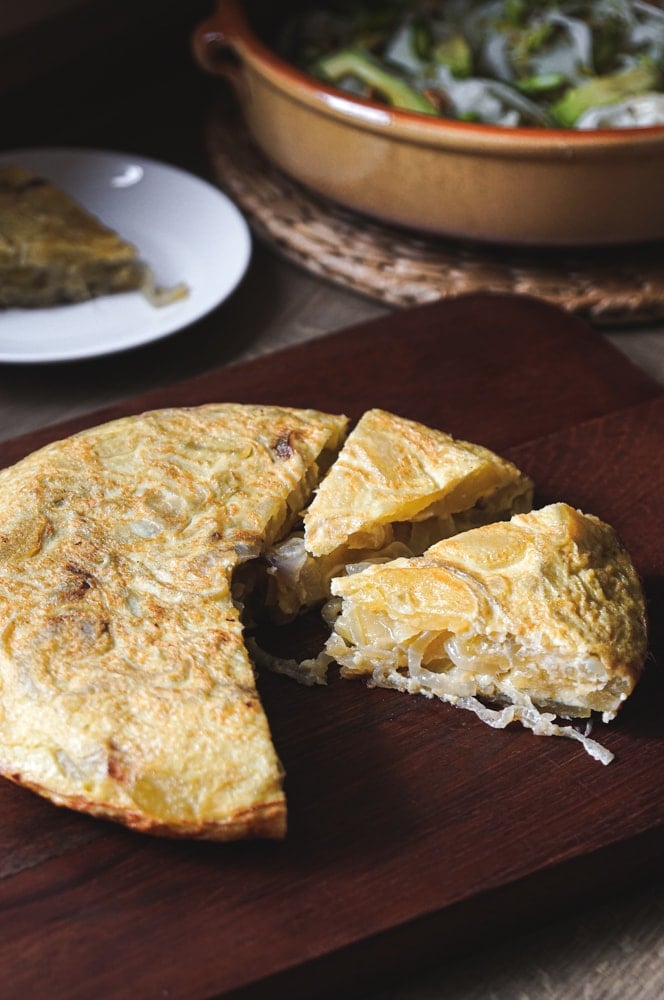 This classic Spanish Potato Tortilla (aka Tortilla de Patatas or Torta Espanola) is a lightened-up version made with thinly sliced potatoes, caramelized onions, eggs, and olive oil that can be served for tapas, breakfast, lunch or dinner. #spanishtortilla #tortilladepatatas #tortaespanola 
