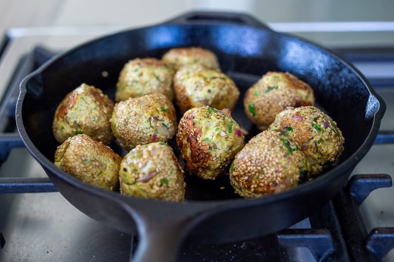 turkey meatballs in a skillet cooking