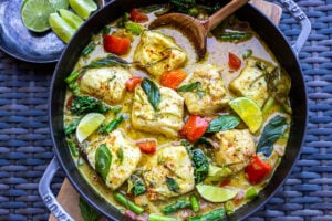 This recipe for Thai Fish Curry with Coconut Milk is brimming with seasonal veggies and bursting with delicious Thai flavors. A quick and easy dinner, perfect for both weeknights and special occasions.  #thaifishcurry