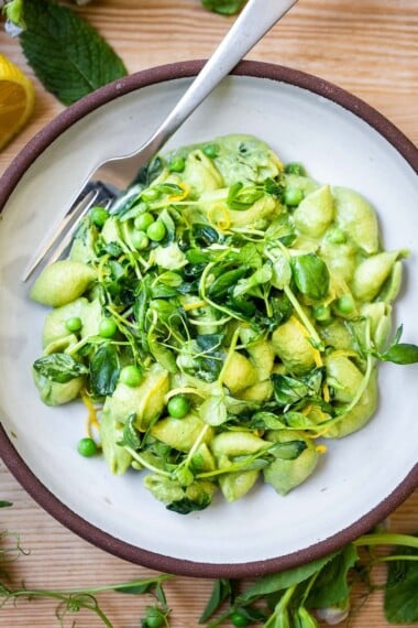 This creamy Pea Pasta is lathered up in the most delicious, luscious sauce made with fresh (or frozen) English peas and mint without a lick of dairy! Vegan and delicious!