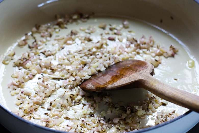 sautéing shallots and cumin seeds with olive oil.