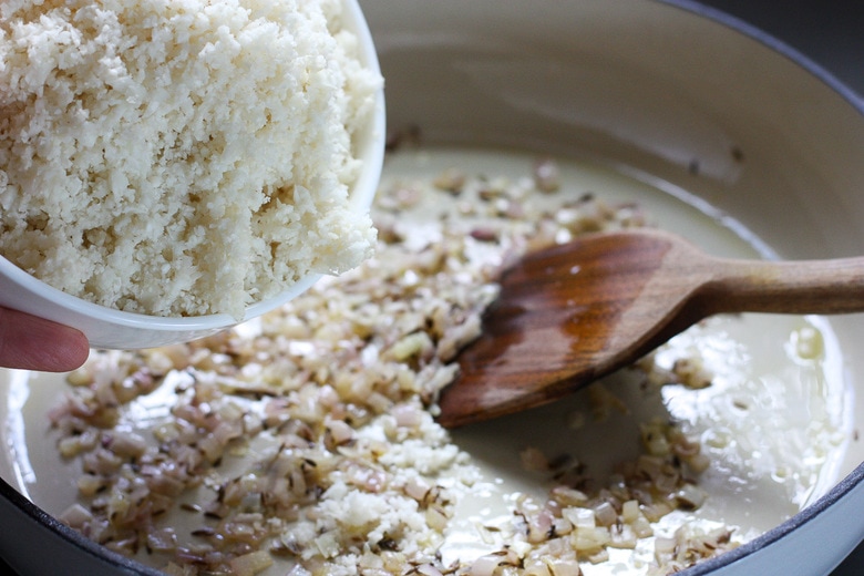 adding cauliflower in with shallots and cook until soft.