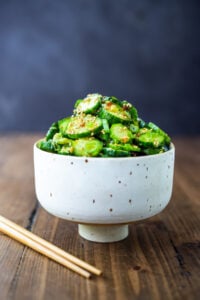 Asian Cucumber Salad is made with rice vinegar, sesame, ginger, garlic and soy, cool and refreshing and pairs well with many things. It's vegan and gluten-free and is a nice addition to meals and bowls you are already making!
