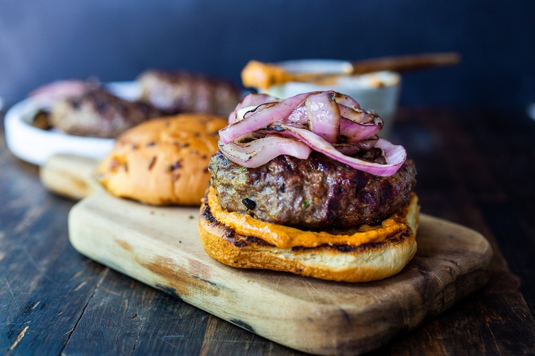 bbuilding the bison burger with the bison burger patty and grilled onions