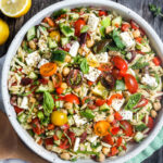 This healthy Greek Pasta Salad is the perfect make-ahead pasta salad for summertime picnics, bbqs, potlucks and easy dinners.  A hearty ratio of fresh veggies combined with tender orzo pasta, chickpeas tossed in the tastiest Greek salad dressing.