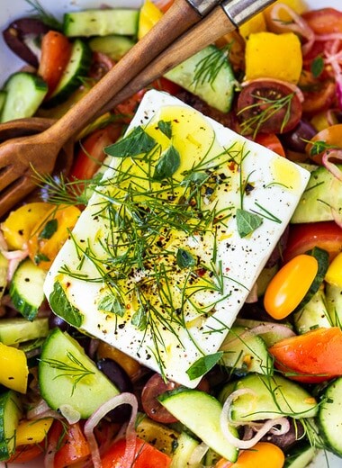 This Greek Salad is everything you want in a summer salad- refreshing, vibrant, flavorful and healthy. Simple ingredients and can be made in 20 mins! #greeksalad
