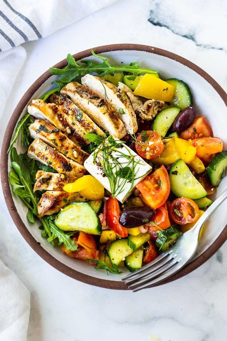 This Grilled Chicken Greek Salad is light and healthy and full of so much flavor! The perfect summer dinner!