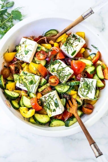 This Greek salad recipe is fresh, authentic, and made with tomatoes, cucumber, olives, feta, and herbs. A classic Mediterranean salad for summer.