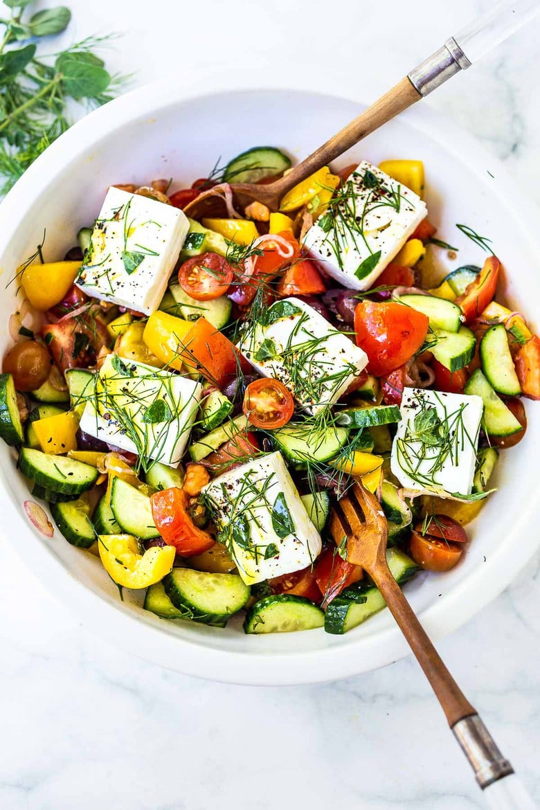 This Greek Salad is everything you want in a summer salad- refreshing, vibrant, flavorful and healthy. Simple ingredients and can be made in 20 mins! #greeksalad