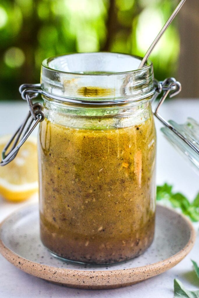 Quick and healthy Greek Salad Dressing is delicious, easy to make and so versatile.  A tasty perk for vegetable salads, pasta salad, chicken marinade and more!