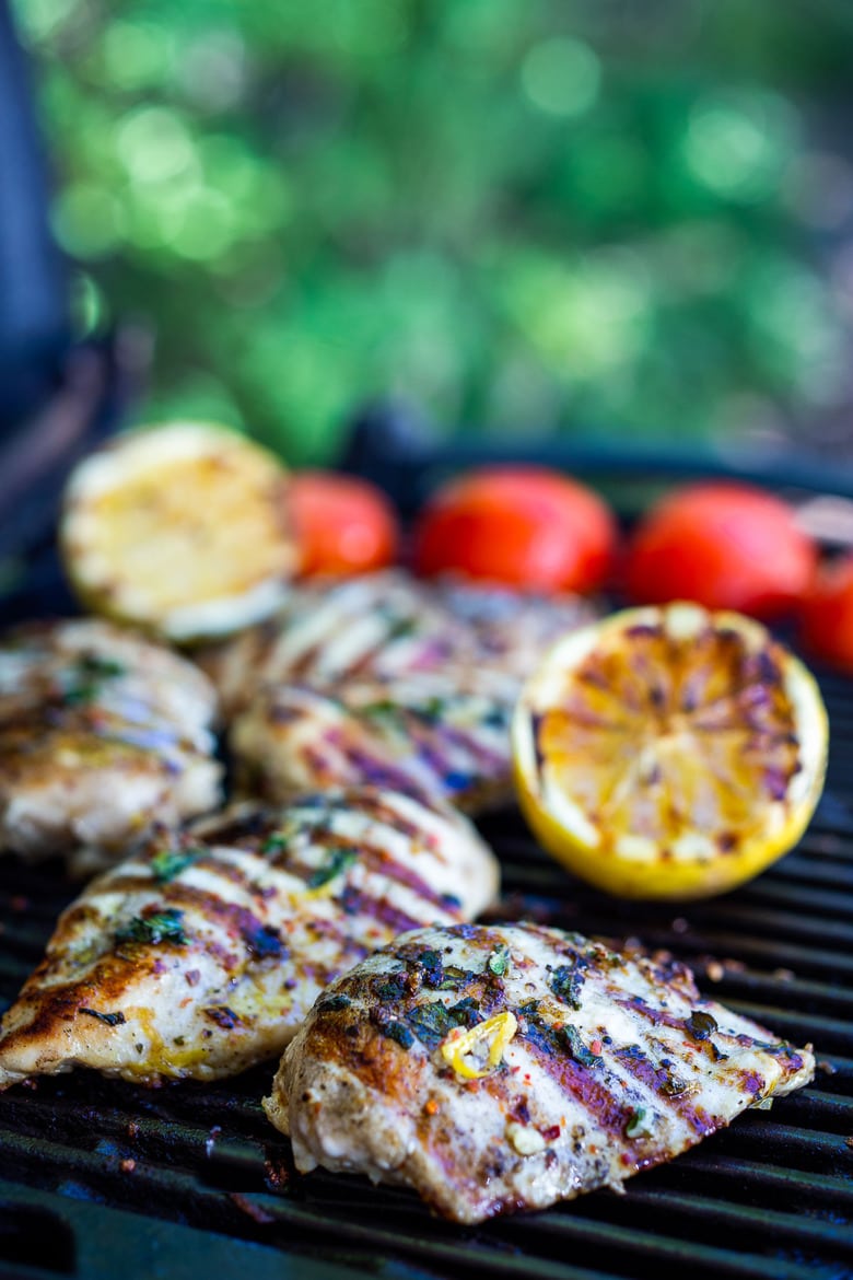 How to make Best Grilled Chicken with lemon, garlic and herbs that turns out juicy and flavorful every single time.  Pair this with a salad, grilled veggies, or meal prep it for the coming week.