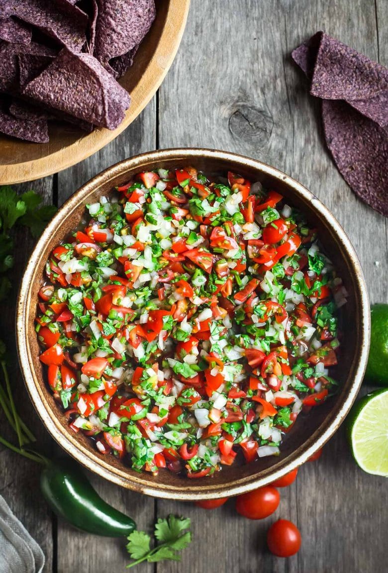 Pico De Gallo is a classic Mexican Salsa made w/ fresh tomatoes, onions, jalapeño & cilantro. Easy to make with just a few ingredients!