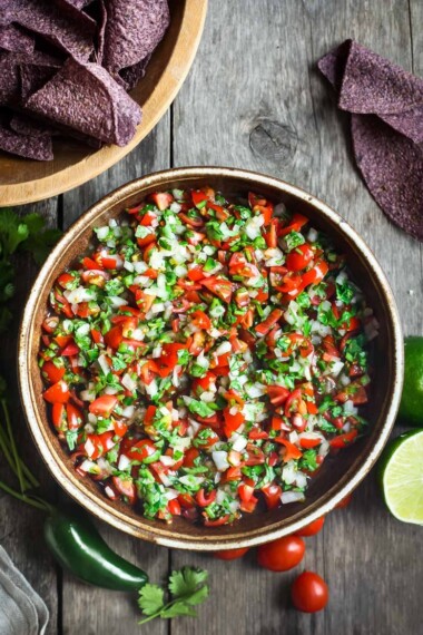 Pico De Gallo is a classic Mexican Salsa made w/ fresh tomatoes, onions, jalapeño & cilantro. Easy to make with just a few ingredients!