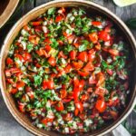 Pico De Gallo is a classic Mexican Salsa made w/ fresh tomatoes, onions, jalapeño & cilantro. Easy to make with just a few ingredients!