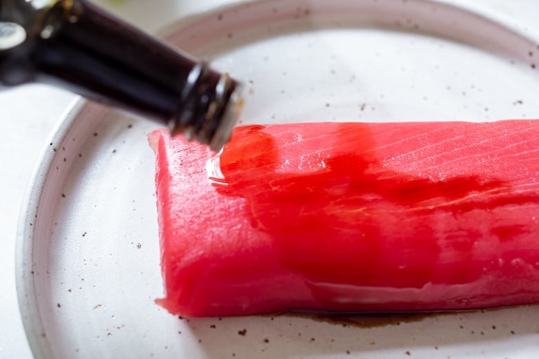 Thaw the Saku Tuna, then coat Tuna in soy sauce.