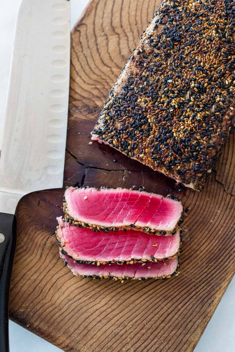 Seared Tuna with Sesame Seed Crust. Learn how to make the best Sesame Crusted Ahi Tuna- crispy golden on the outside and rare on the inside in just 10 minutes flat!