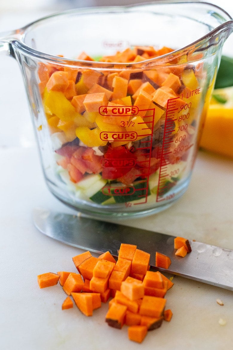 four cups of finely chopped veggies in a measuring cup 