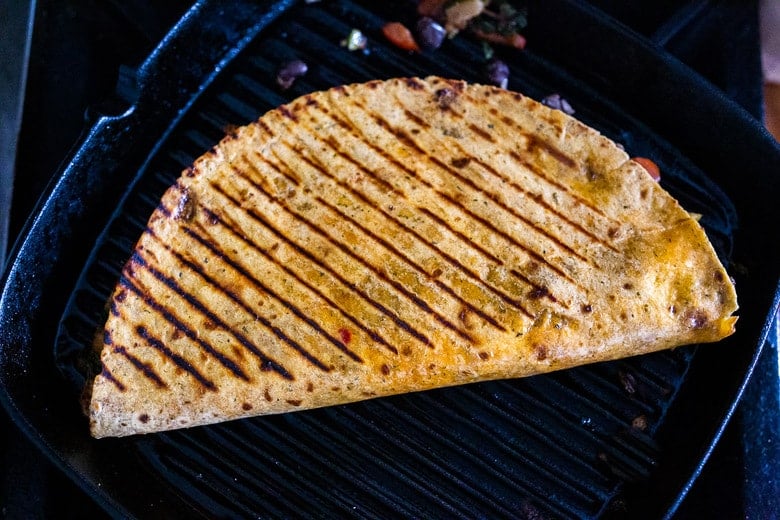 quesadilla grilling in a grill pan