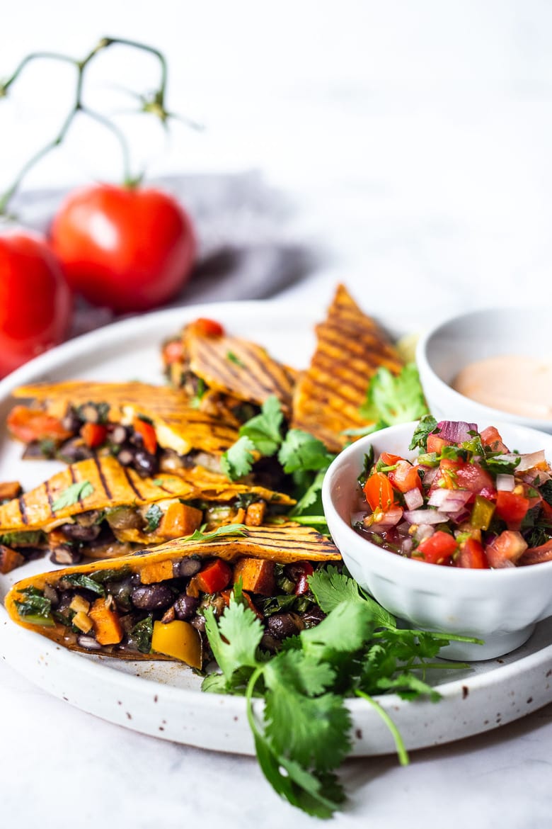 Farmers Market Veggie Quesadillas with black beans and farmer's market veggies like bell peppers, zucchini, sweet potato, greens, and melty cheese (optional) seasoned with Mexican spices. Vegan-adaptable and Gluten-free adaptable!