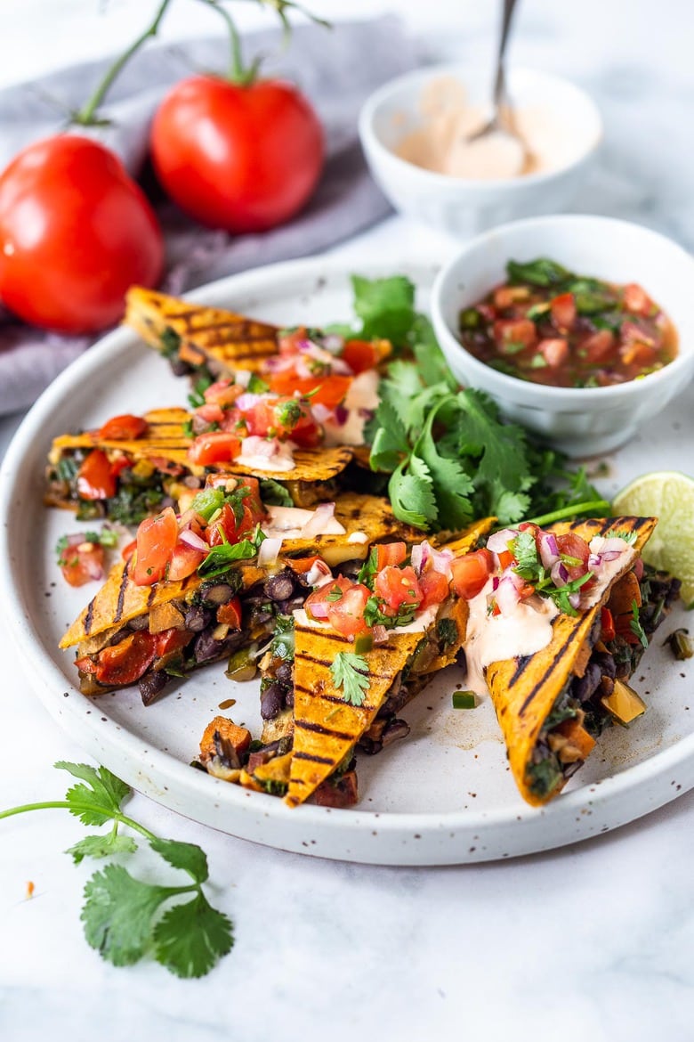 Farmers Market Veggie Quesadillas with black beans and farmer's market veggies like bell peppers, zucchini, sweet potato, greens, and melty cheese (optional) seasoned with Mexican spices. Vegan-adaptable and Gluten-free adaptable!