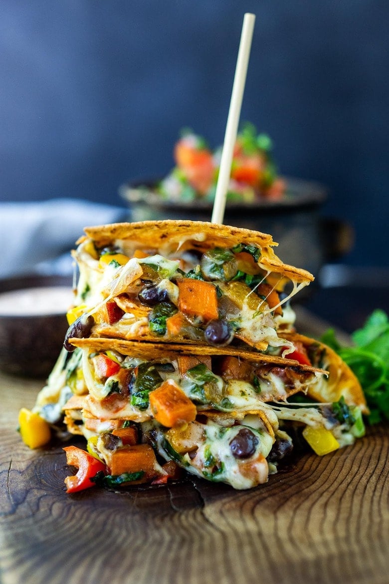 Vegetarian Quesadillas with black beans and farmer's market veggies like bell peppers, zucchini, sweet potato and greens.  Easy, healthy and full of delicious Mexican Flavors! Vegan-adaptable and Gluten-free adaptable!