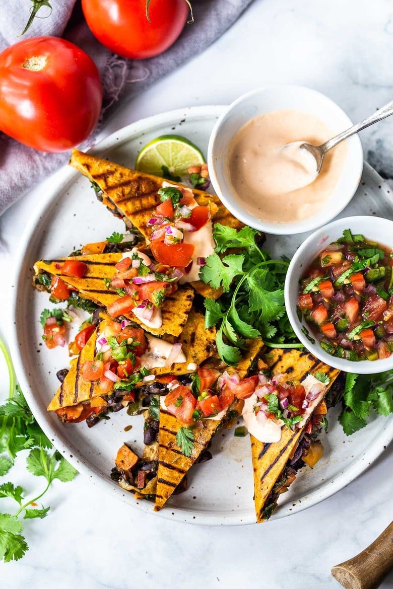 Farmers Market Veggie Quesadillas with black beans and farmer's market veggies like bell peppers, zucchini, sweet potato, greens, and melty cheese (optional) seasoned with Mexican spices. Vegan-adaptable and Gluten-free adaptable!