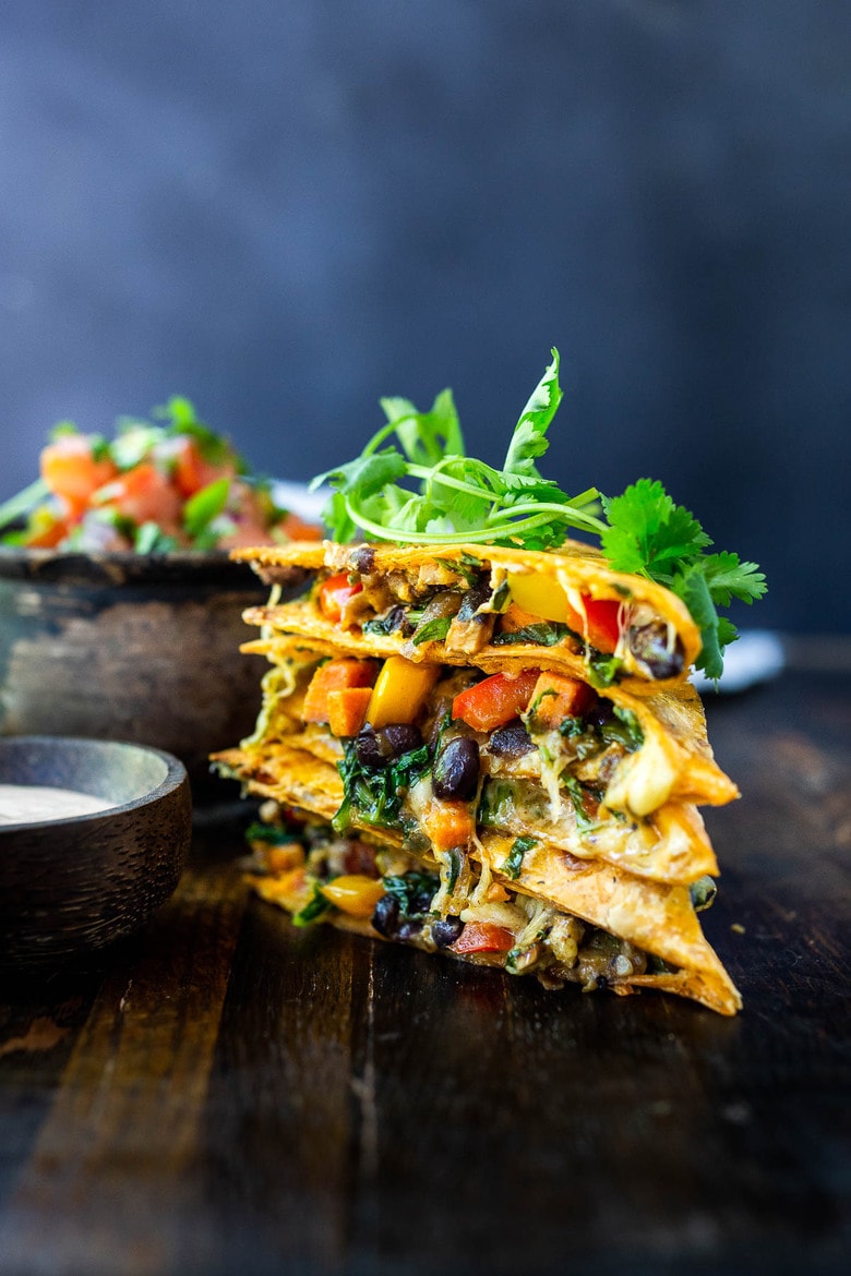 Vegetarian Quesadillas with black beans and farmer's market veggies like bell peppers, zucchini, sweet potato, greens, and melty cheese (optional) seasoned with Mexican spices. Vegan-adaptable and Gluten-free adaptable!