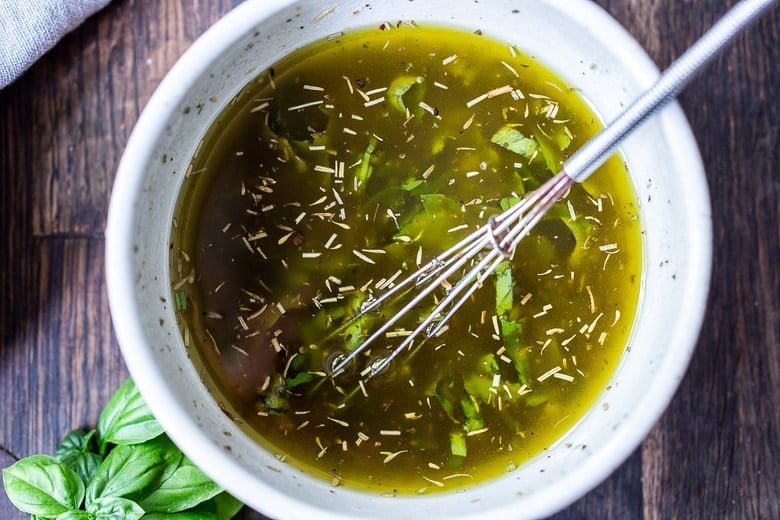 the dressing for Antipasto salad in a bowl 