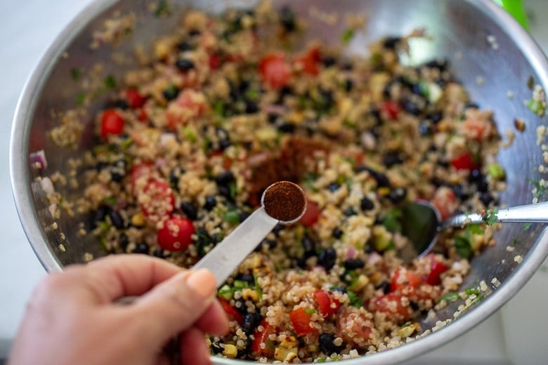 season the black bean quinoa salad with chipotle powder for smoky heat