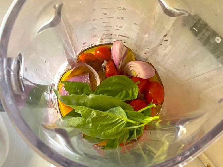 Tomato vinaigrette ingredients in a blender.