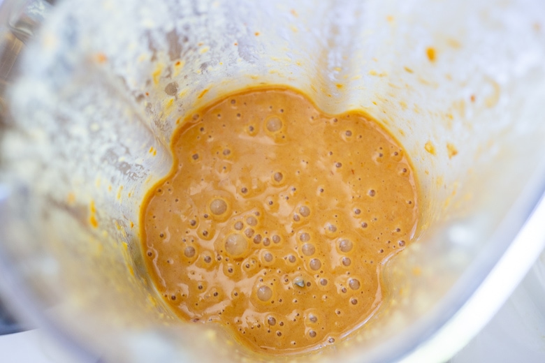 blended up peanut dressing in a blender