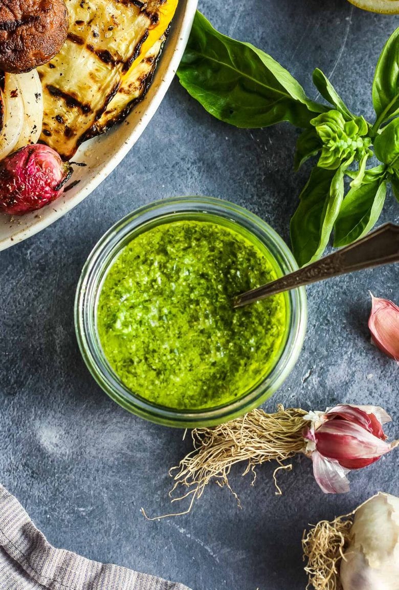 This fresh Basil Pesto recipe is brimming with bright and savory peppery basil goodness!  This version is nut-free, made with nutritious hemp seeds and a splash of lemon.