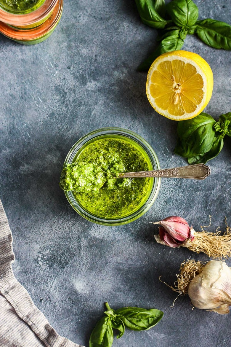 This fresh Basil Pesto recipe is brimming with bright and savory peppery basil goodness!  This version is nut-free, made with nutritious hemp seeds and a splash of lemon.