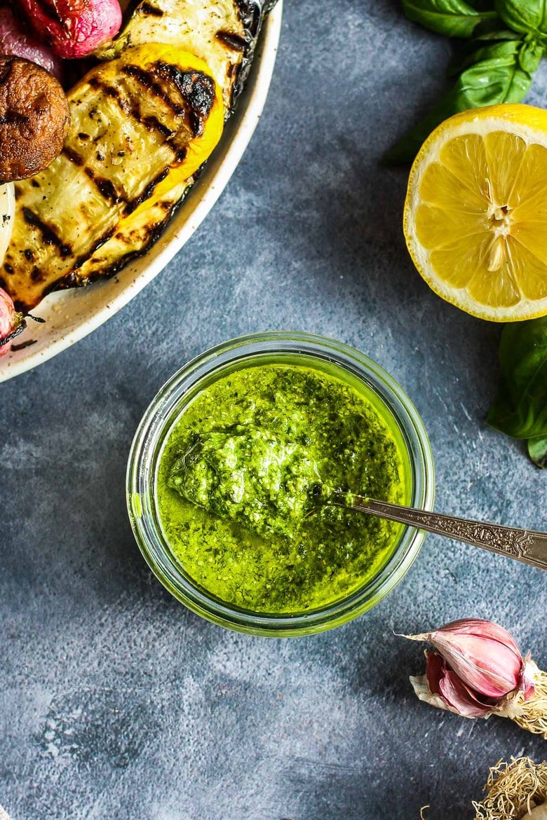 This fresh Basil Pesto recipe is brimming with bright and savory peppery basil goodness!  This version is nut-free, made with nutritious hemp seeds and a splash of lemon.