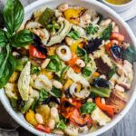 Delicious Grilled Tuscan Bread Salad with colorful sweet bell peppers, artichoke hearts and white beans tossed in a flavorful white balsamic dressing. Make it on the barbecue for an easy outdoor summer meal with your favorite grilled protein! Vegan!