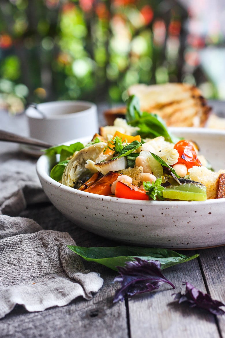 Delicious Grilled Tuscan Bread Salad with colorful sweet bell peppers, artichoke hearts and white beans tossed in a flavorful white balsamic dressing.  Make it on the barbecue for an easy outdoor summer meal with your favorite grilled protein!  Vegan!