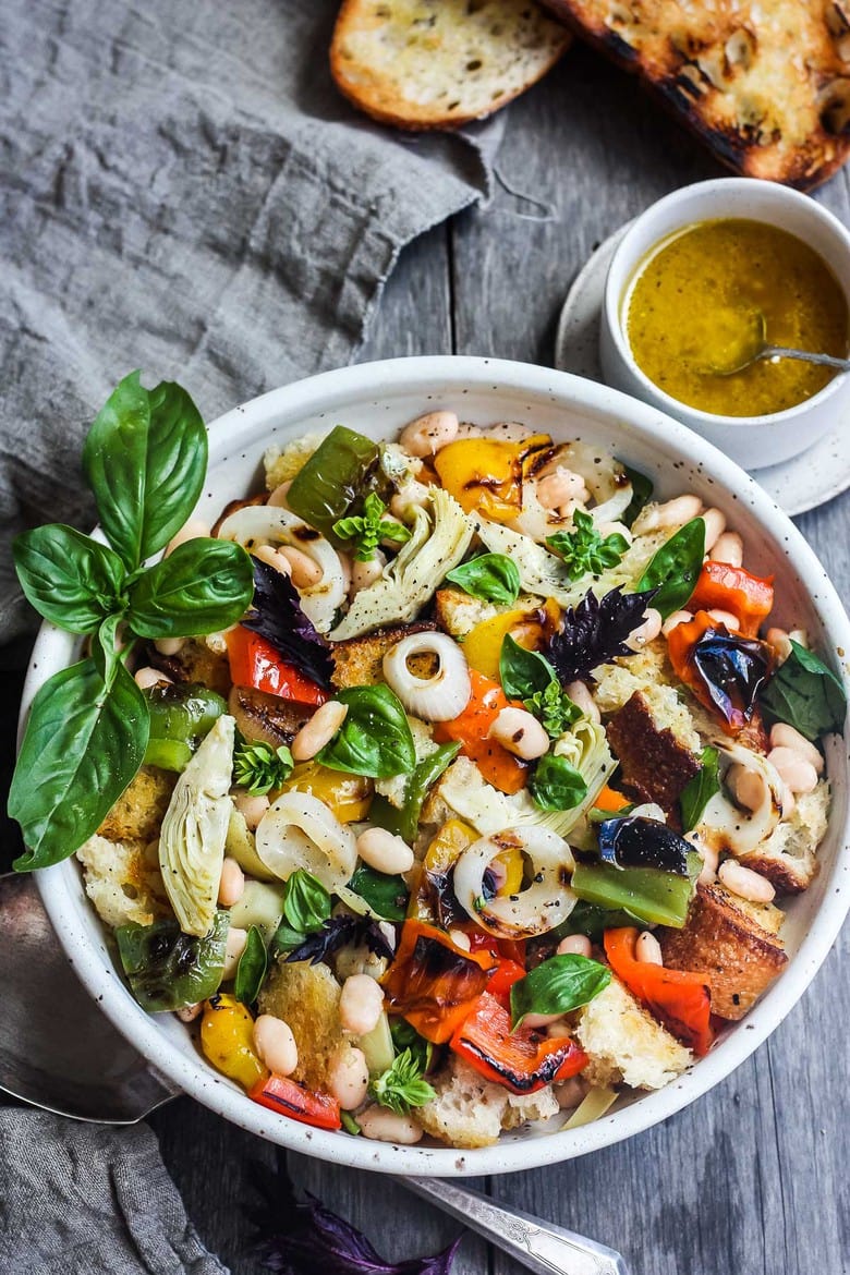 Delicious Grilled Tuscan Bread Salad with colorful sweet bell peppers, artichoke hearts and white beans tossed in a flavorful white balsamic dressing.  Make it on the barbecue for an easy outdoor summer meal with your favorite grilled protein!  Vegan!