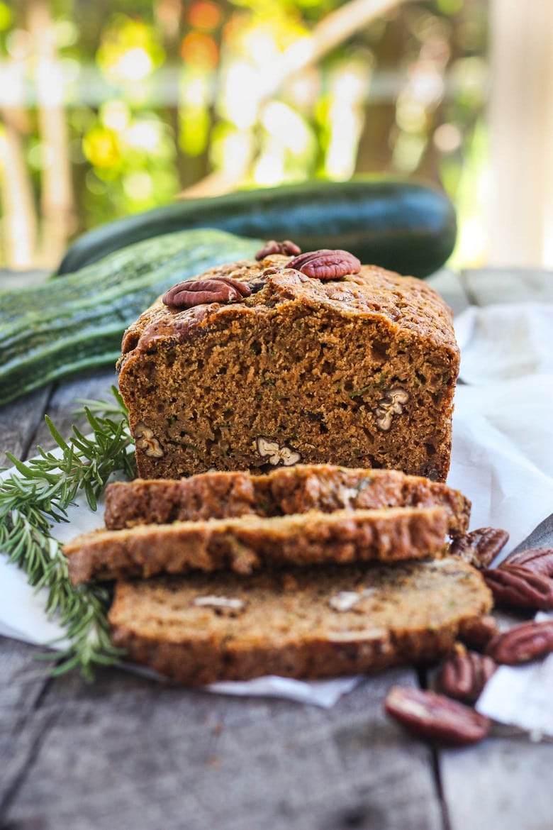 This healthy wholesome Zucchini Bread is tender and full of flavor.  Made with whole wheat pastry flour and coconut sugar with a touch of orange and rosemary, packing a whole pound of zucchini in one loaf!