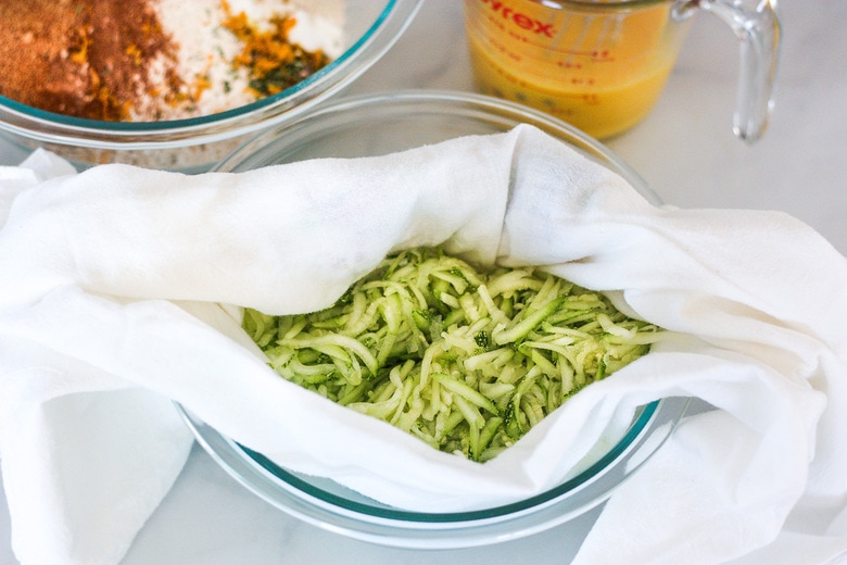 grated zucchini in a dish towel