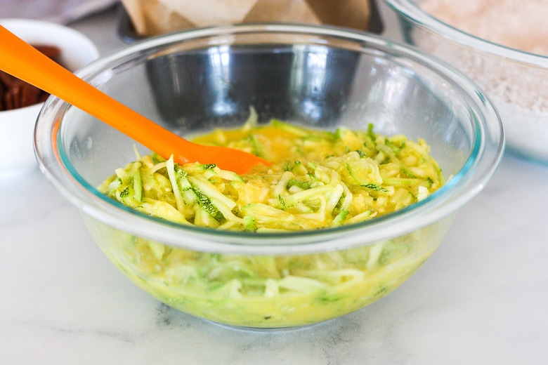 bowl mixing wet ingredients and zucchini
