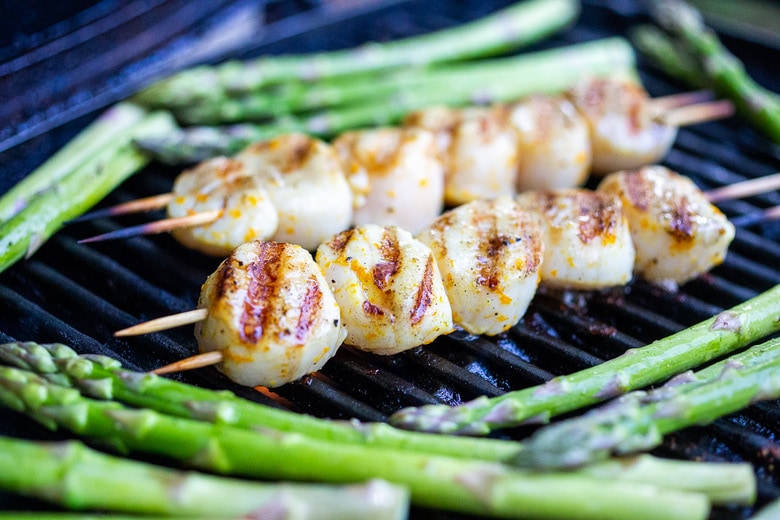 scallops grilling on a grill.