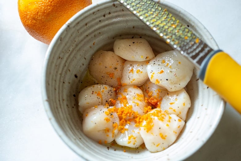add grilled scallop ingredients to a bowl