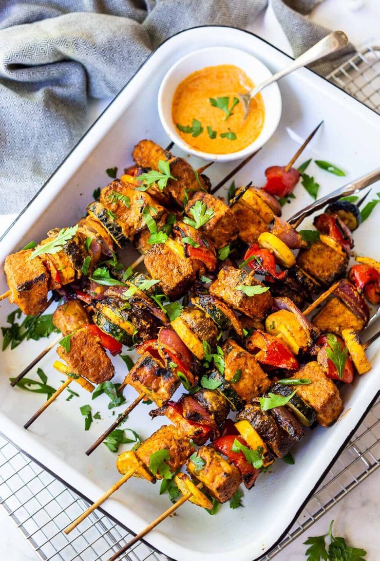 Grilled Veggie Kabobs with Harissa Yogurt -made with your choice of protein (tempeh, tofu,or chicken)! A delcious summer meal that packs a big punch of flavor! Perfect for summer bbqs and gatherings! Vegan-adaptable. #kababs #veggiekabobs, #veganskewers, #veggieskewers #harrissakabobs