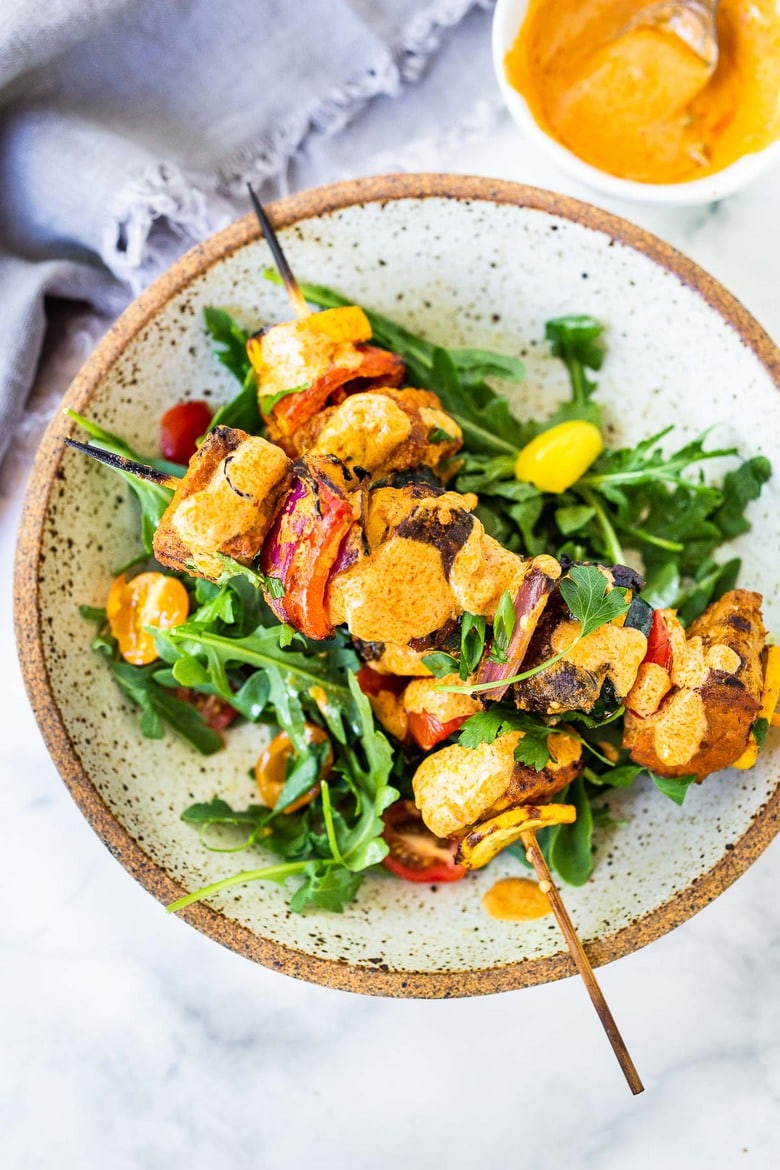 Grilled Veggie Kabobs with Harissa Yogurt -made with your choice of protein (tempeh, tofu,or chicken)! A delcious summer meal that packs a big punch of flavor! Perfect for summer bbqs and gatherings! Vegan-adaptable. #kababs #veggiekabobs, #veganskewers, #veggieskewers #harrissakabobs