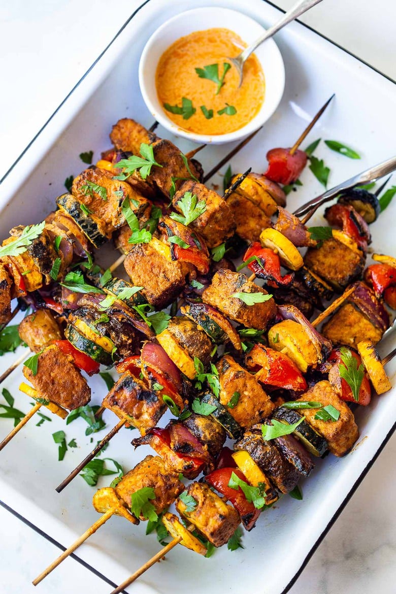 Grilled Veggie Kabobs with Harissa Yogurt -made with your choice of protein (tempeh, tofu,or chicken)! A delcious summer meal that packs a big punch of flavor! Perfect for summer bbqs and gatherings! Vegan-adaptable. 