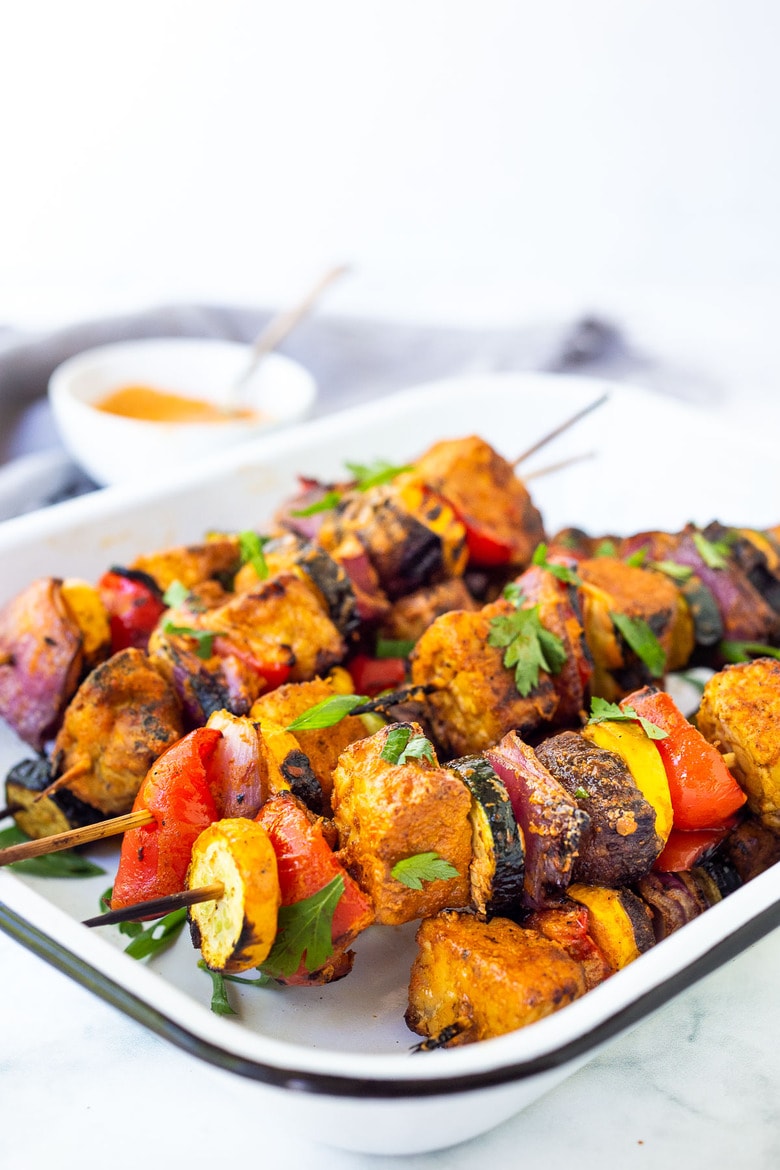 Grilled Veggie Kabobs with Harissa Yogurt -made with your choice of protein (tempeh, tofu,or chicken)! A delcious summer meal that packs a big punch of flavor! Perfect for summer bbqs and gatherings! Vegan-adaptable. #kababs #veggiekabobs, #veganskewers, #veggieskewers #harrissakabobs