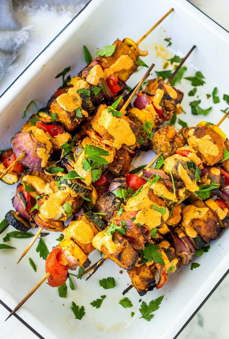 Grilled Veggie Kabobs with Harissa Yogurt -made with your choice of protein (tempeh, tofu,or chicken)! A delcious summer meal that packs a big punch of flavor! Perfect for summer bbqs and gatherings! Vegan-adaptable. #kababs #veggiekabobs, #veganskewers, #veggieskewers #harrissakabobs