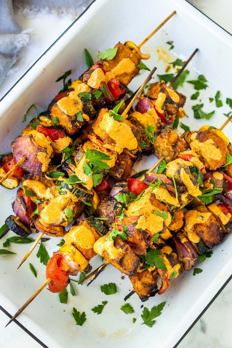 Grilled Veggie Kabobs with Harissa Yogurt -made with your choice of protein (tempeh, tofu,or chicken)! A delcious summer meal that packs a big punch of flavor! Perfect for summer bbqs and gatherings! Vegan-adaptable. #kababs #veggiekabobs, #veganskewers, #veggieskewers #harrissakabobs