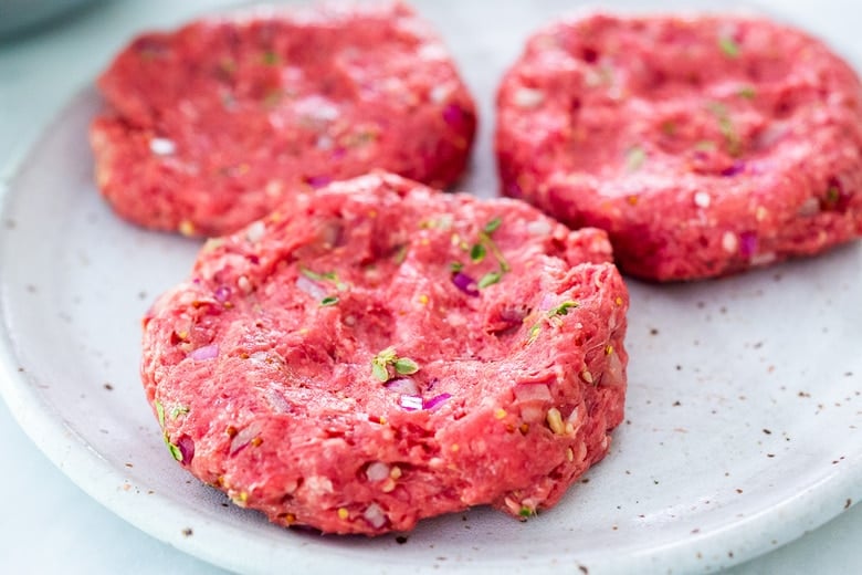 formed bison burger patties on a plate