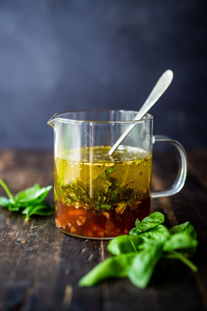 This easy Italian Dressing recipe is perfect for drizzling on green salads or mixing into pasta salad. It's simple to make and a healthy alternative to store bought dressing!